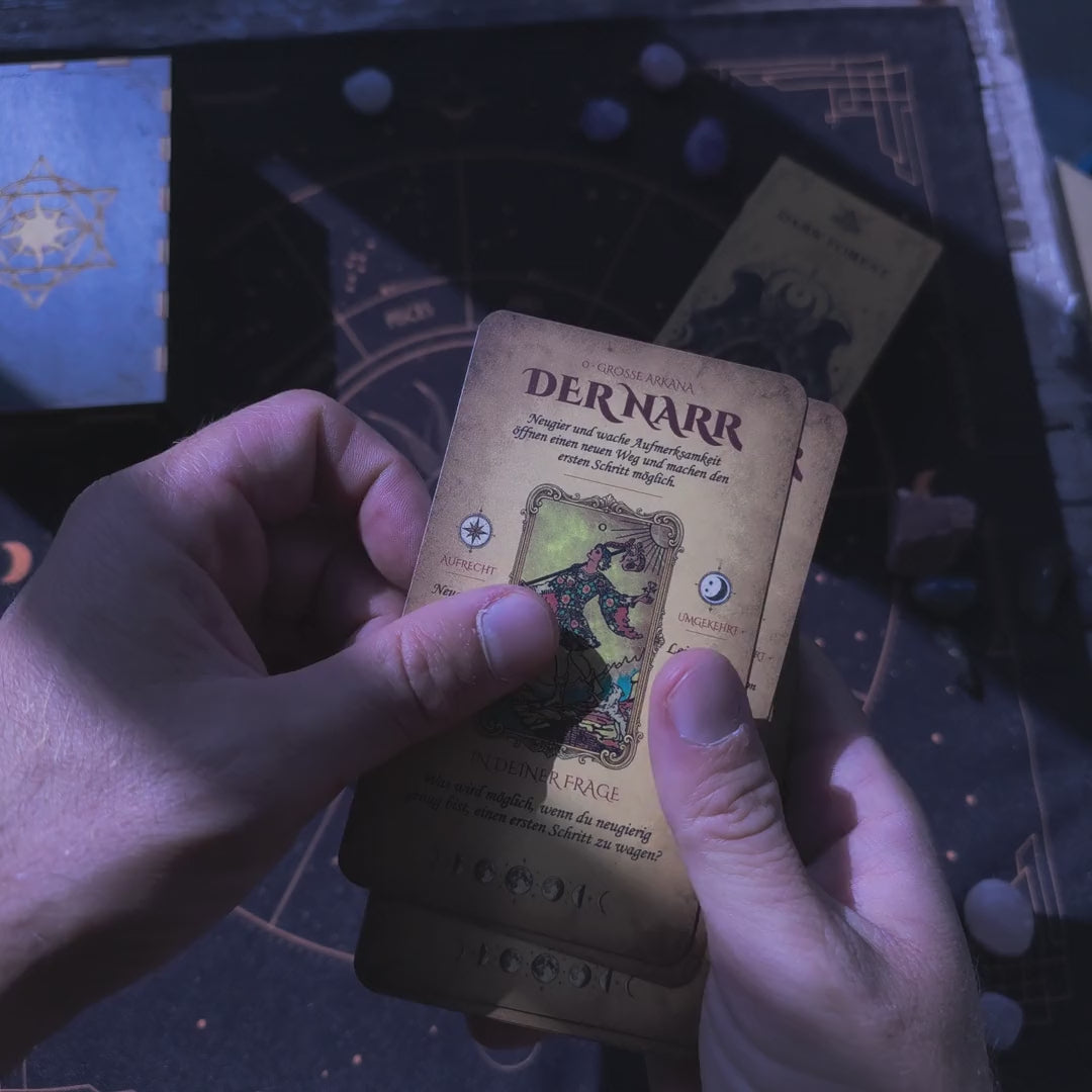 German learning tarot deck in hand: cards with German meanings and the thickness of the 78-card deck