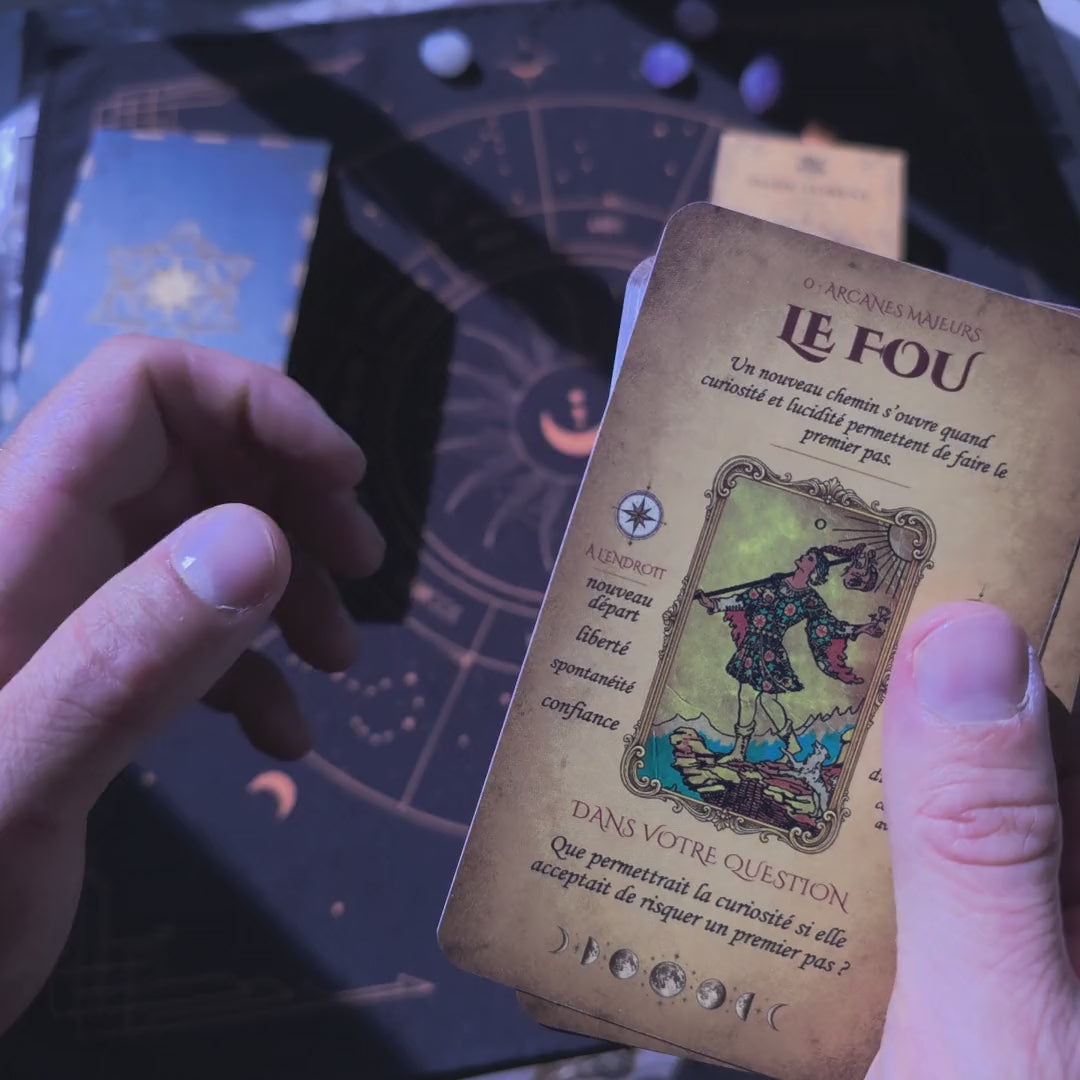 French learning tarot deck in hand: cards with French meanings and the thickness of the 78-card deck